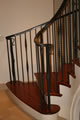 All iron on mill built Brazilian cherry straight to radius stair with mid-landing, Piedmont, CA