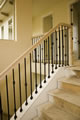 Curbwall With Iron Balusters And Oak Railing