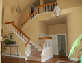 Before: Iron ballusters w/ wood rail, carpeted treads